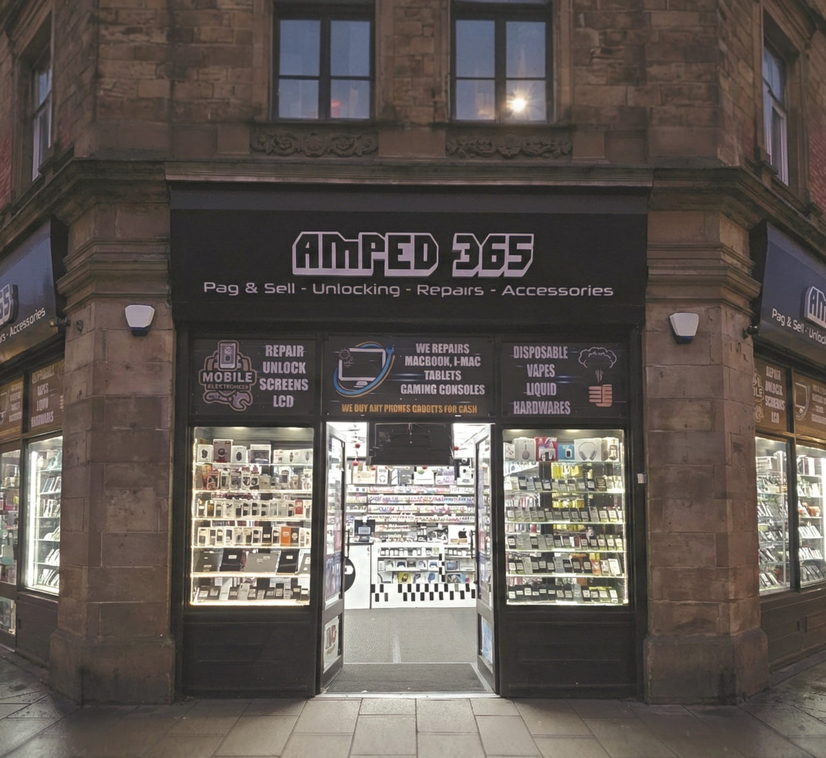 The Amped365 shop front on Boar Lane, Leeds, lit up in the evening